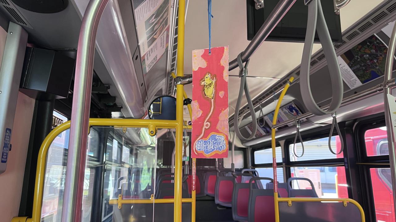 Art Hanger on bus