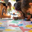 Community members painting during Moo-seum grand opening.